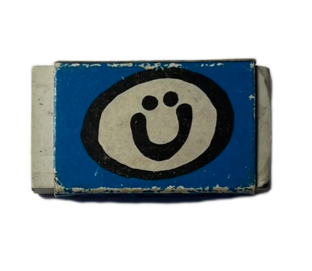 white rubber with blue wrapper and smiley face
